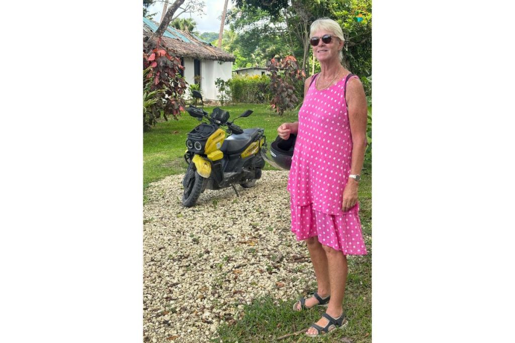 Cute little yellow scooter with the suspension of a tank and me, trying to look glam