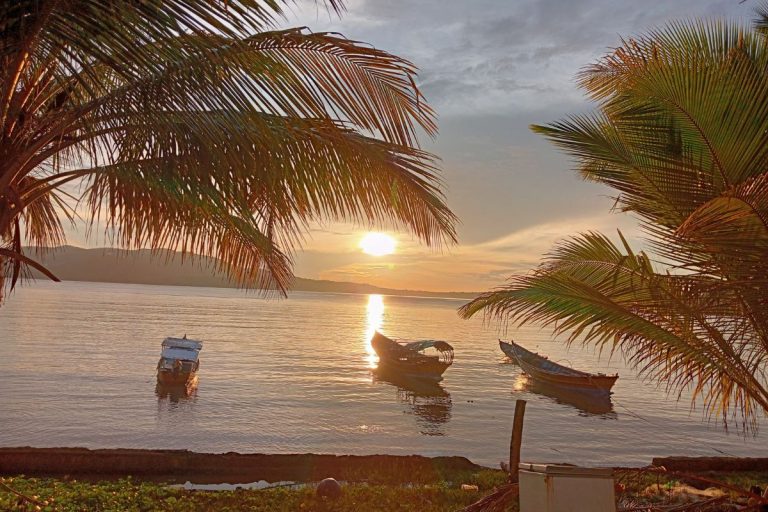 Sunset in the Andoman Islands with three boats in the foreground