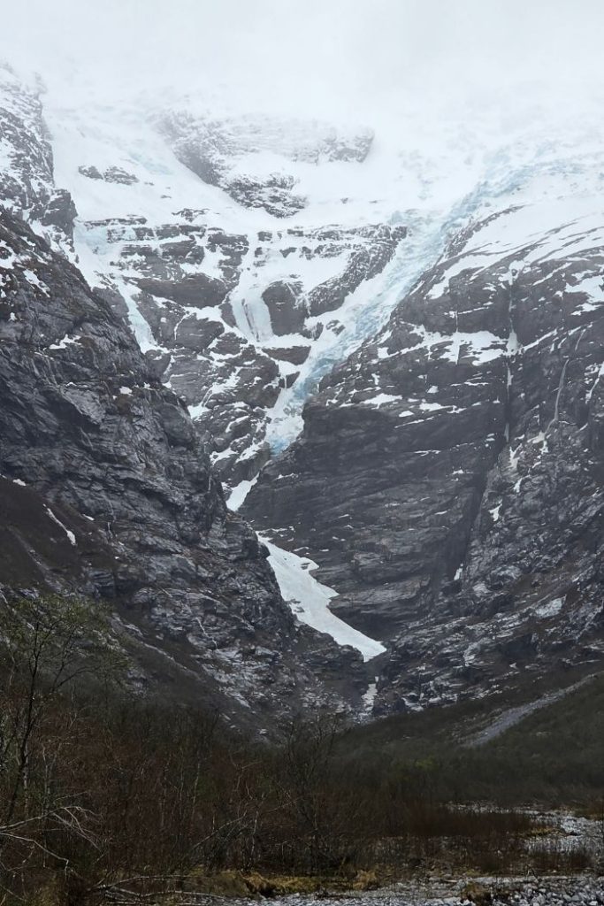 Briksdal Glacier with blue snow on top showing the frozen water